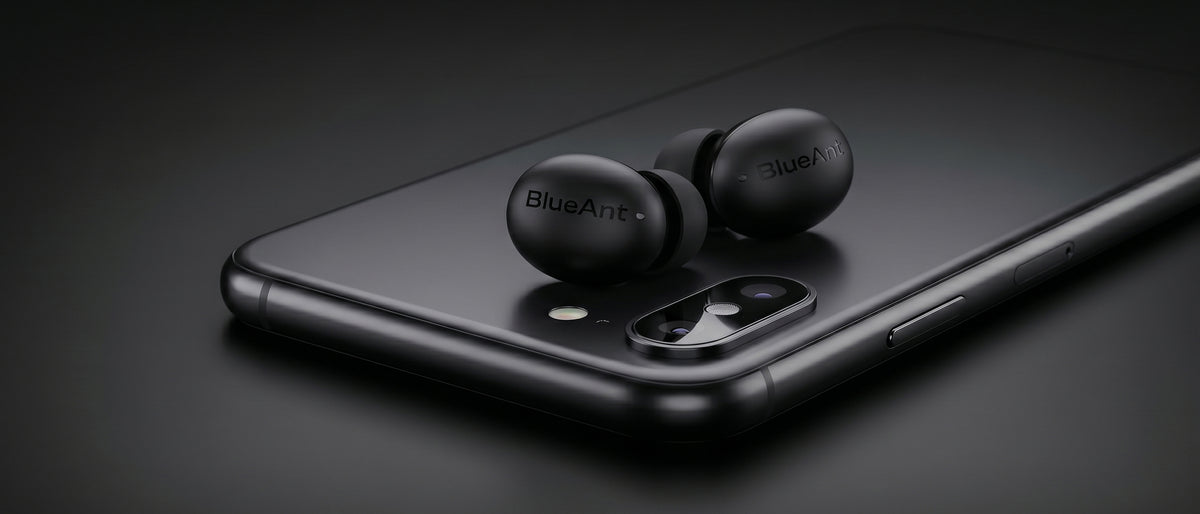 BlueAnt Pump Air Micro true wireless earbuds in black resting on a smartphone