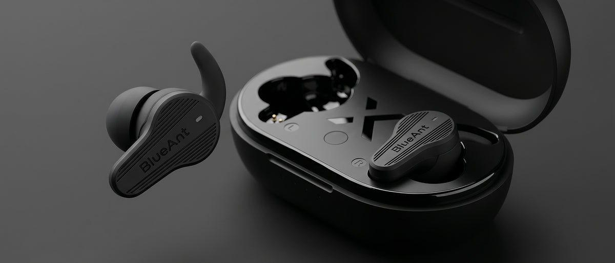 BlueAnt Pump Air X3 sport earbuds in black with wing tips and open charging case