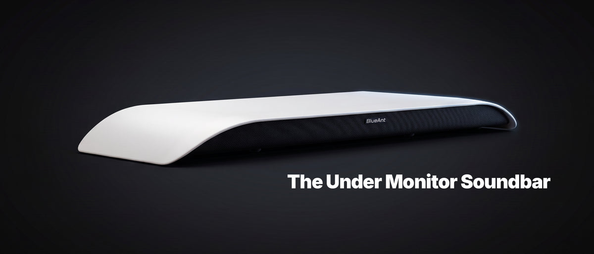 BlueAnt Soundblade under-monitor soundbar in white, angled view on a dark