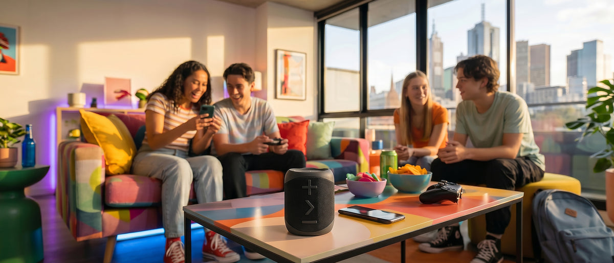 BlueAnt X1i Bluetooth speaker on a table in a city apartment lounge